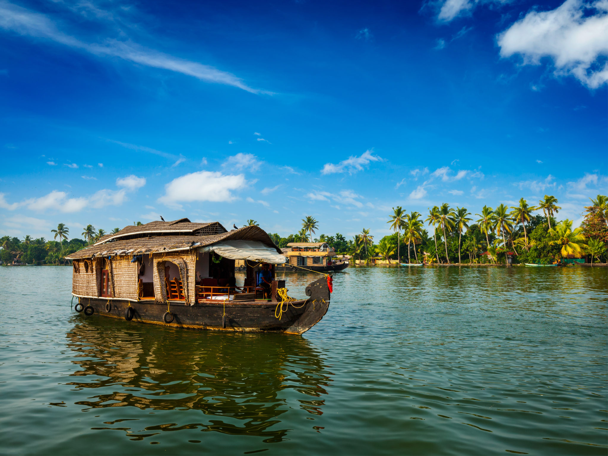 Travel tourism Kerala background - houseboat on Kerala backwaters. Kerala, India